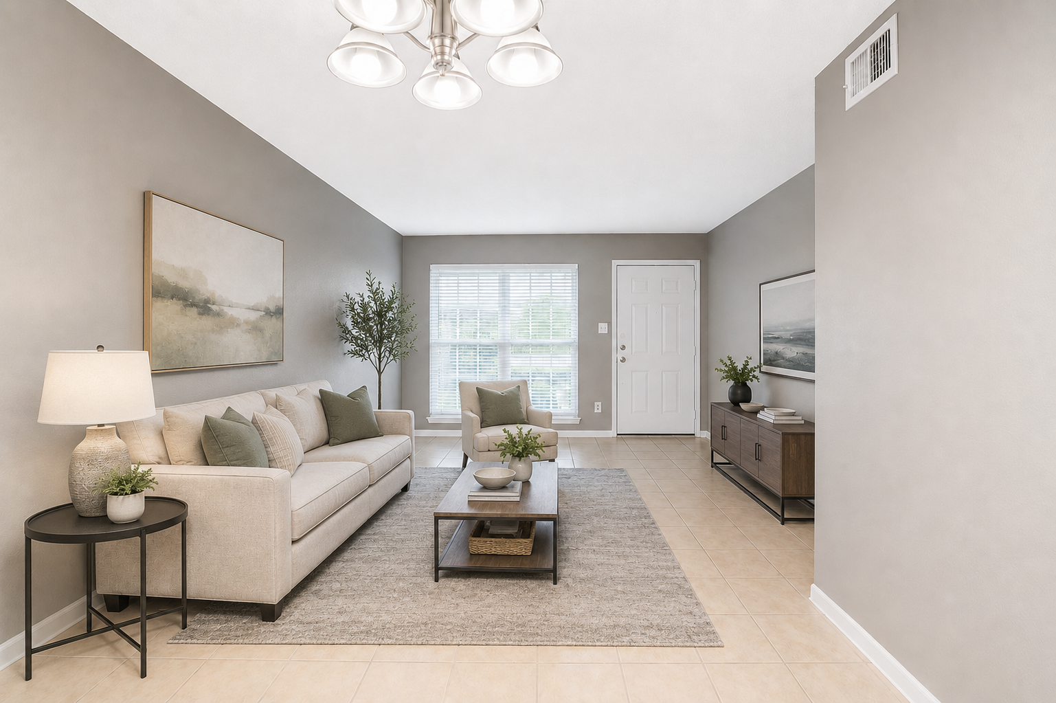 Bright apartment living room with tile floors and large window